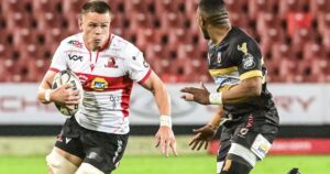 Fidelity ADT Lions player runs at an Airlink Pumas defender during a Carling Currie Cup Premier Division match