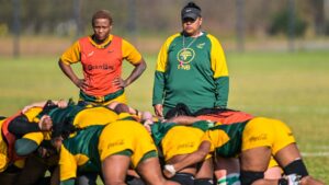 Springbok Women pack practise scrums at training while a coach looks on