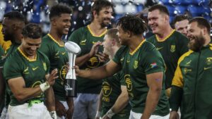 Springbok players celebrate with the trophy after the Springboks beat Argentina in Buenos Aires