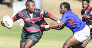 Leopards Women player fends off a tackle during a Pick n Pay Women's Super League 2 match