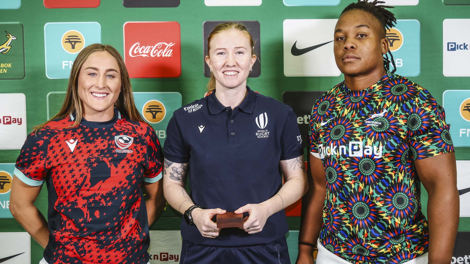 A USA Rugby player, a World Rugby match official and a Springbok Women player at a match presentation